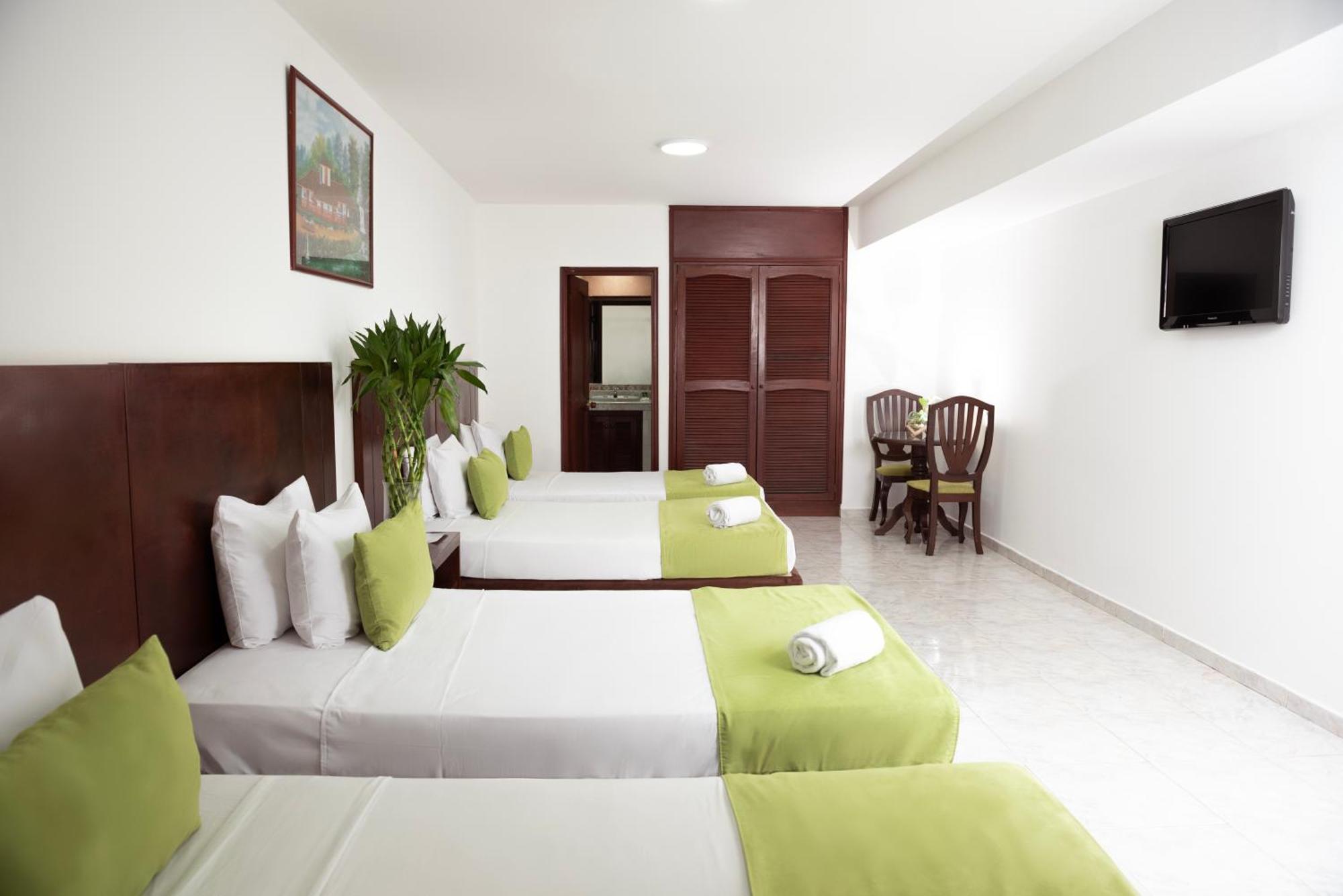 Tama Hotel Granada Real Cali Bagian luar foto
